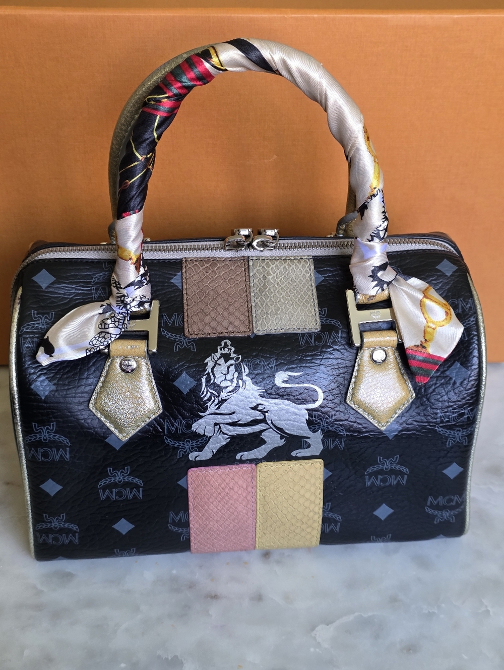 MCM BOSTON STYLE PRINCESS LION in Multiple Colors Of Snakeskin Embossed Trims